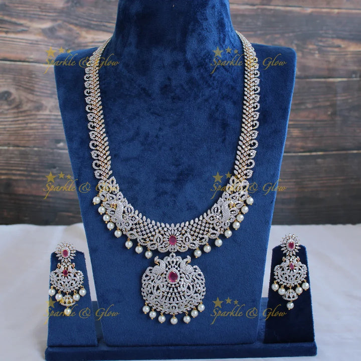 Gorgeous Peacock and floral design American diamond long necklace with pealrs and ruby - Sparkle and Glow