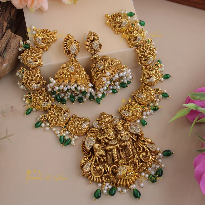 Beautiful Radha Krishna dancing peacock carved short necklace with pearls and green beads - Sparkle and Glow
