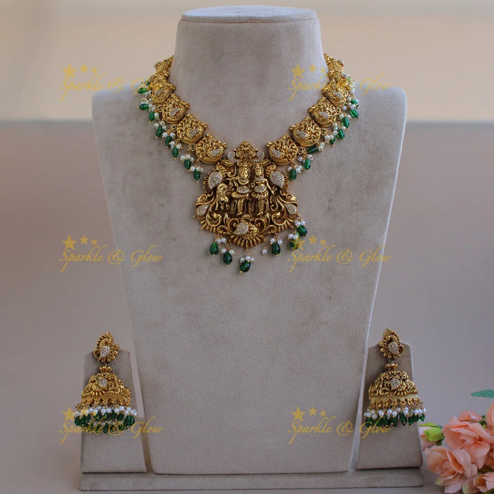 Beautiful Radha Krishna dancing peacock carved short necklace with pearls and green beads - Sparkle and Glow
