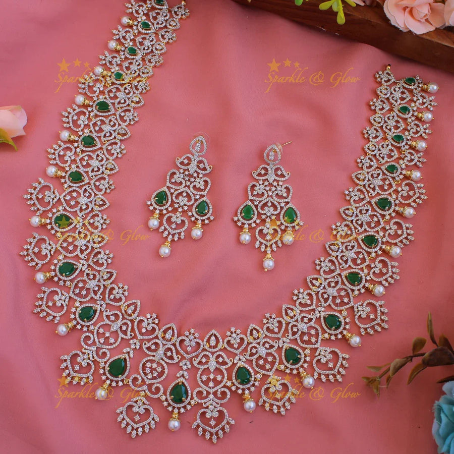 Grand intricate floral leaflet design American diamond long necklace with emerald and pearls - green - Sparkle and Glow
