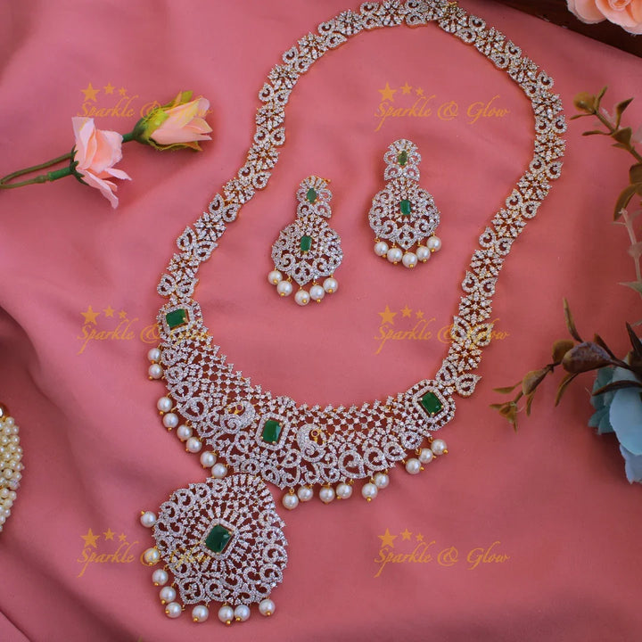 Satement Peacock floral design American diamond long necklace with emerald and pearl drops - Sparkle and Glow