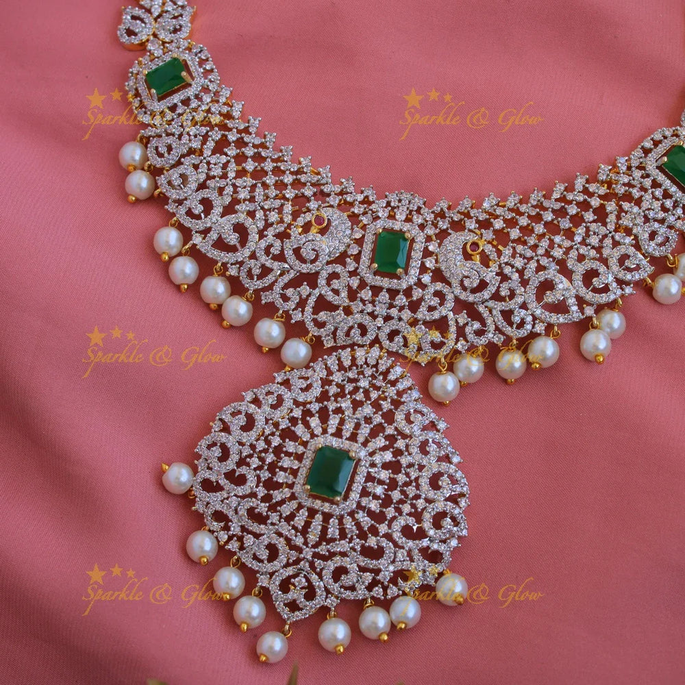 Satement Peacock floral design American diamond long necklace with emerald and pearl drops - Sparkle and Glow
