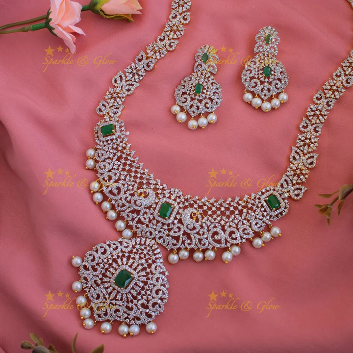 Satement Peacock floral design American diamond long necklace with emerald and pearl drops - Sparkle and Glow