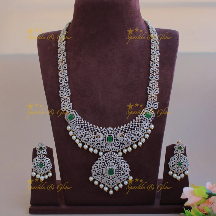 Satement Peacock floral design American diamond long necklace with emerald and pearl drops - Sparkle and Glow