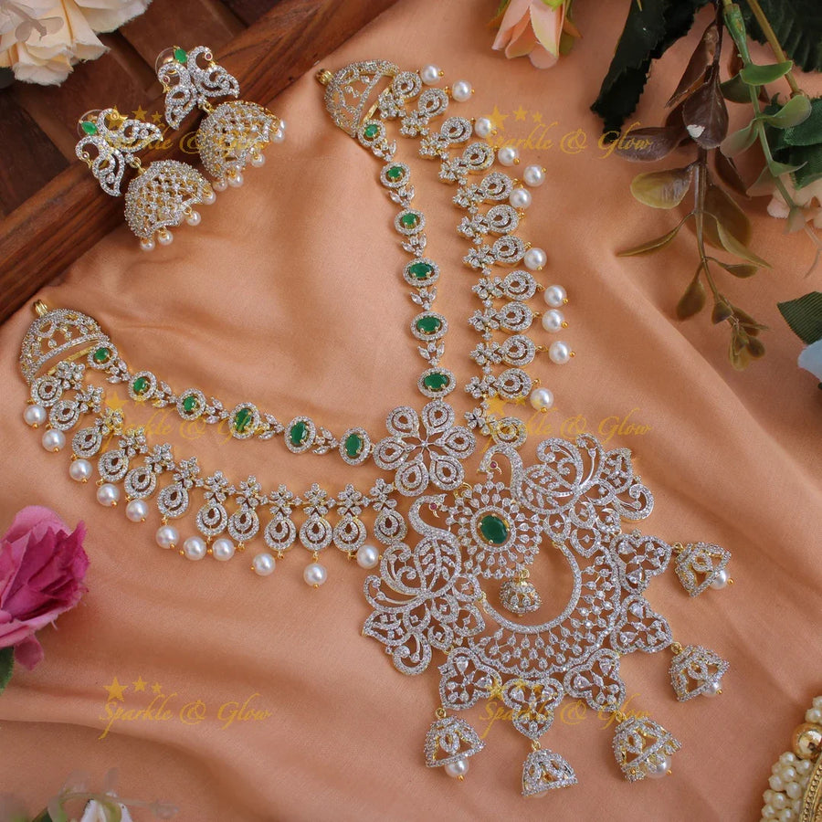 Elegant Peacock floral design American diamond layer short necklace with emerald and jhumuka drops - Sparkle and Glow