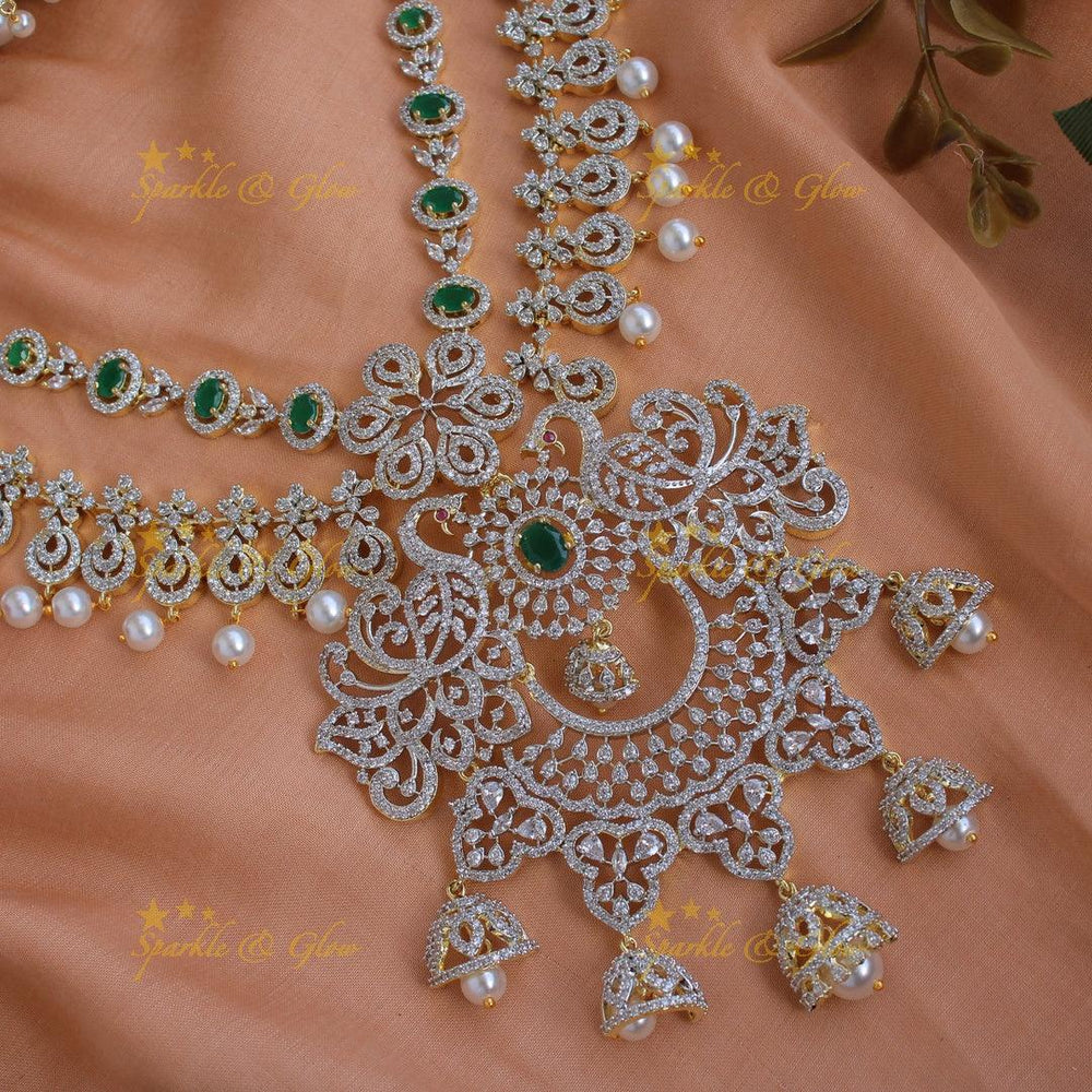 Elegant Peacock floral design American diamond layer short necklace with emerald and jhumuka drops - Sparkle and Glow