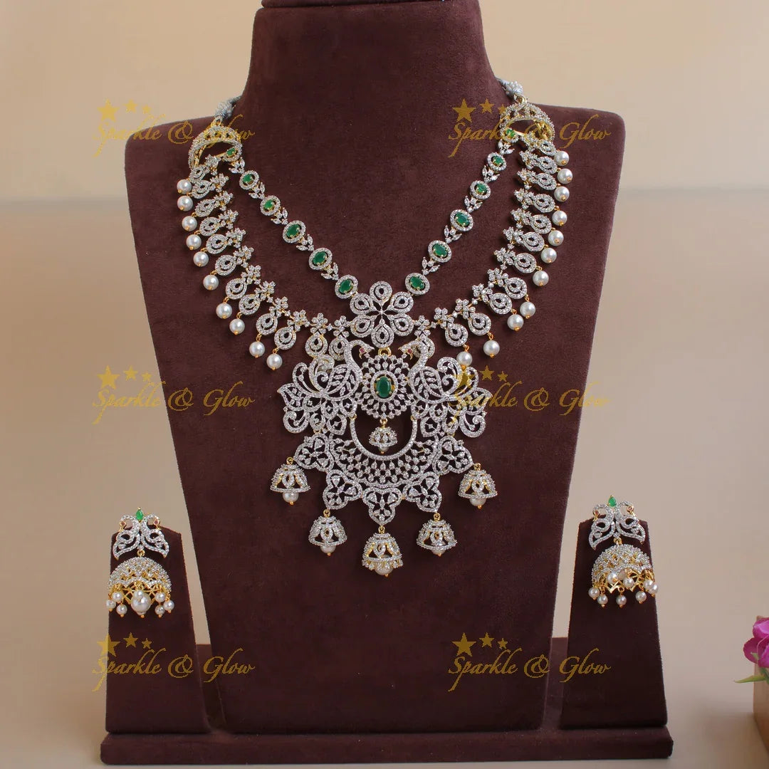 Elegant Peacock floral design American diamond layer short necklace with emerald and jhumuka drops - Sparkle and Glow