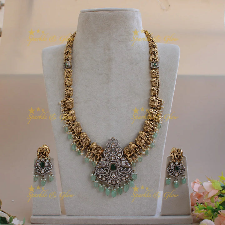 Statement Elephant carved gold and black finish Victorian AD long necklace with mint green beads - Sparkle and Glow