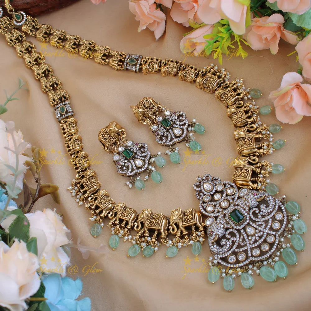 Statement Elephant carved gold and black finish Victorian AD long necklace with mint green beads - Sparkle and Glow
