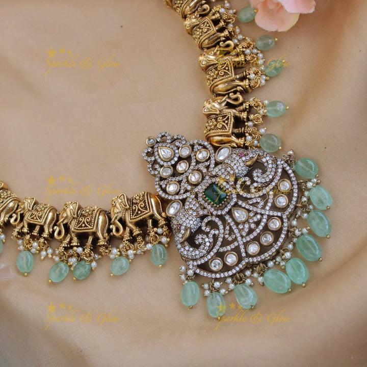Statement Elephant carved gold and black finish Victorian AD long necklace with mint green beads - Sparkle and Glow