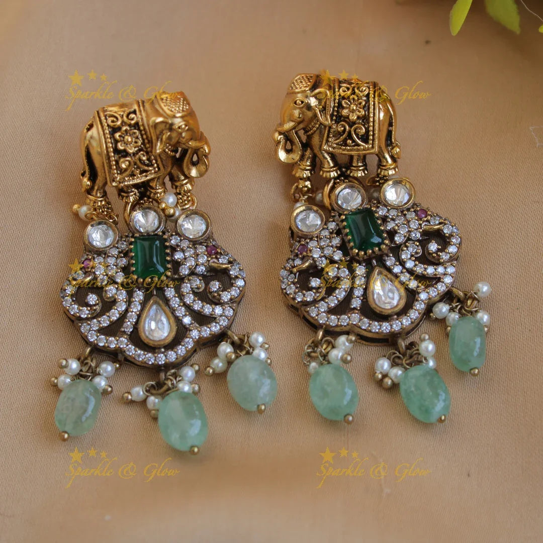 Statement Elephant carved gold and black finish Victorian AD long necklace with mint green beads - Sparkle and Glow