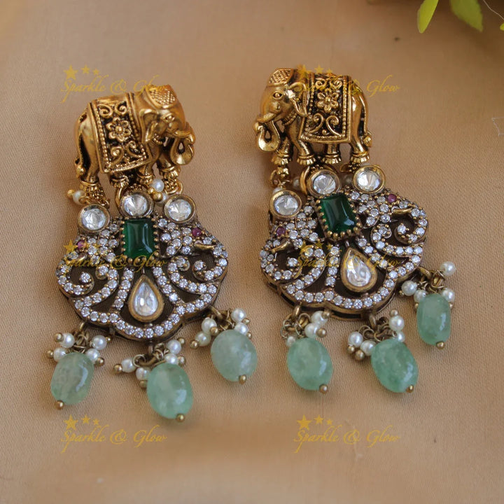 Statement Elephant carved gold and black finish Victorian AD long necklace with mint green beads - Sparkle and Glow