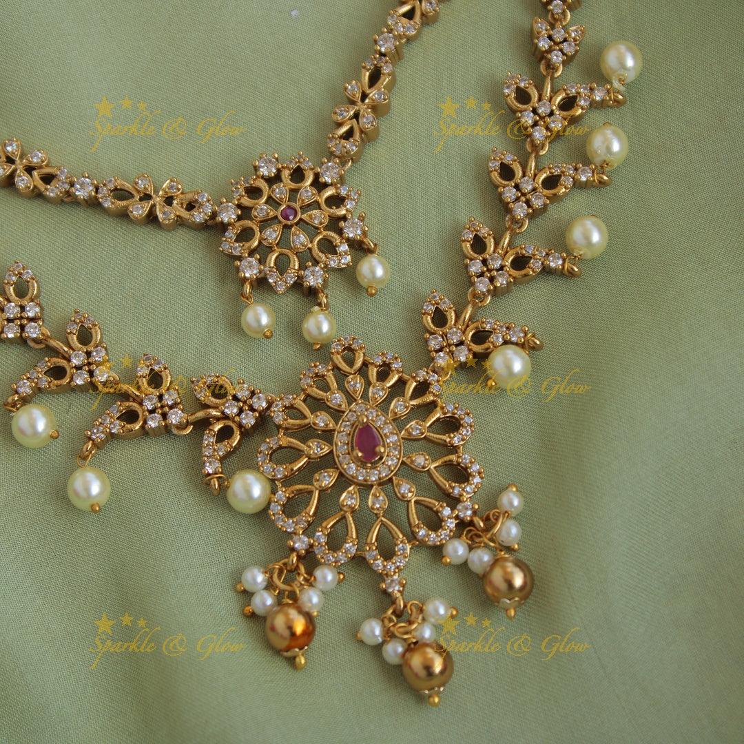 Beautiful floral two layer AD short necklace with pearls and gold beads - Sparkle and Glow