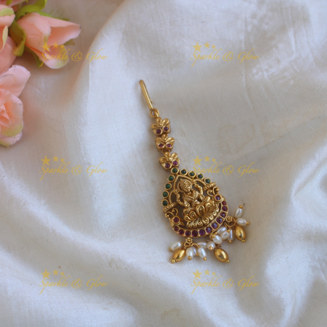 Gold alike Lakshmi carved maang tikka with ruby emerald and rice pearl drops