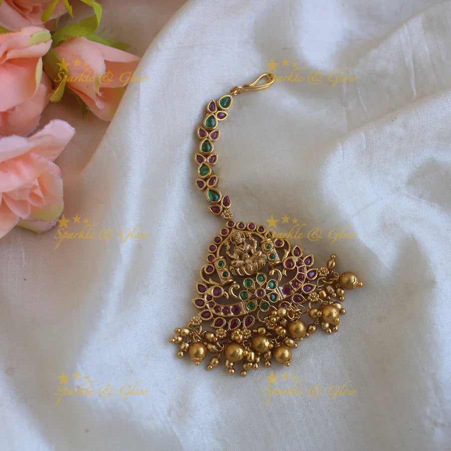 Grand Lakshmi peacock carved maang tikka with ruby emerald and gold beads - Sparkle and Glow