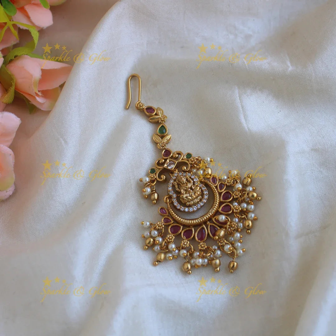 Beautiful Lakshmi half moon gutta pusalu maang tikka with ruby emerald - Sparkle and Glow