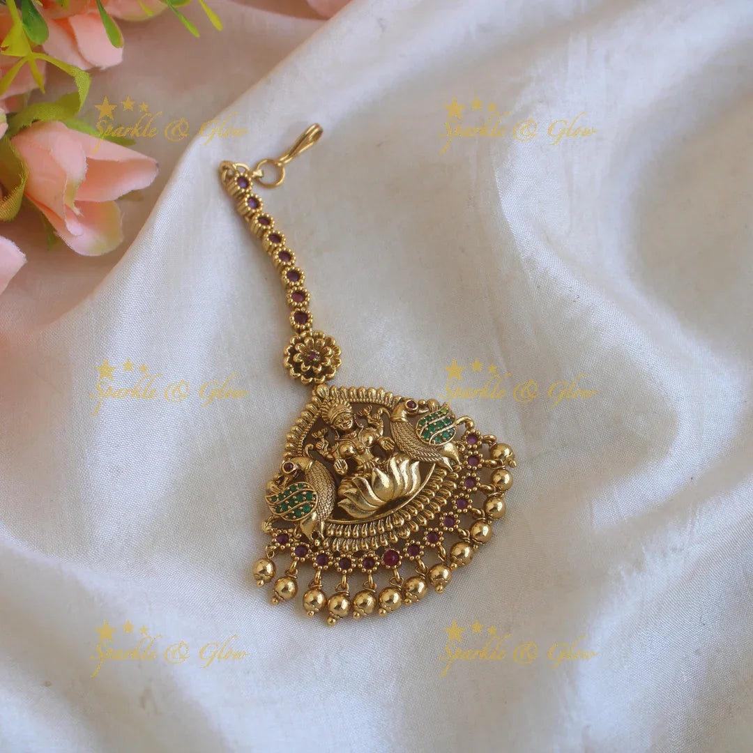 Beautiful gold alike Lakshmi peacock carved maang tikka with gold beads - Sparkle and Glow