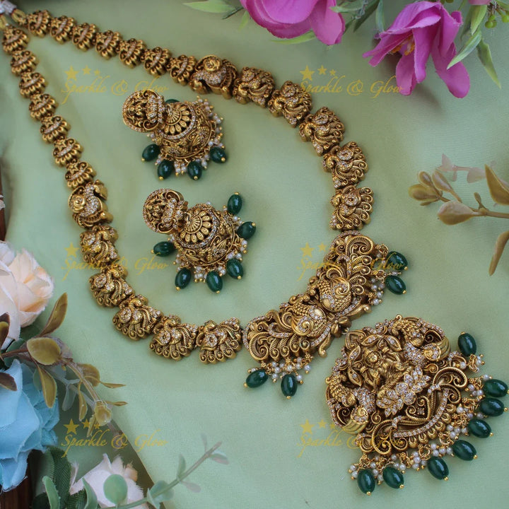 Grand intricate Lakshmi Peacock carved long necklace with CZ stones and green beads - Sparkle and Glow