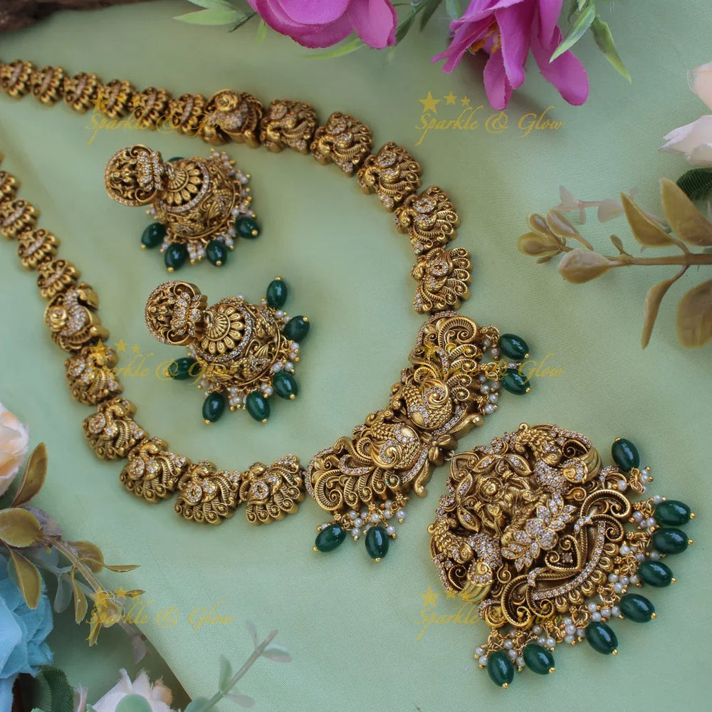 Grand intricate Lakshmi Peacock carved long necklace with CZ stones and green beads - Sparkle and Glow