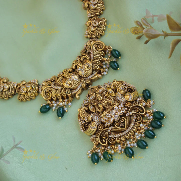 Grand intricate Lakshmi Peacock carved long necklace with CZ stones and green beads - Sparkle and Glow