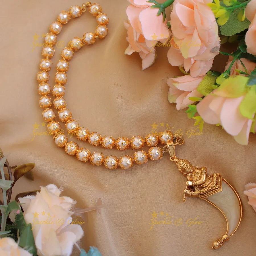 Statement Krishna carved single Puliguru pendent with pearl chain - Sparkle and Glow