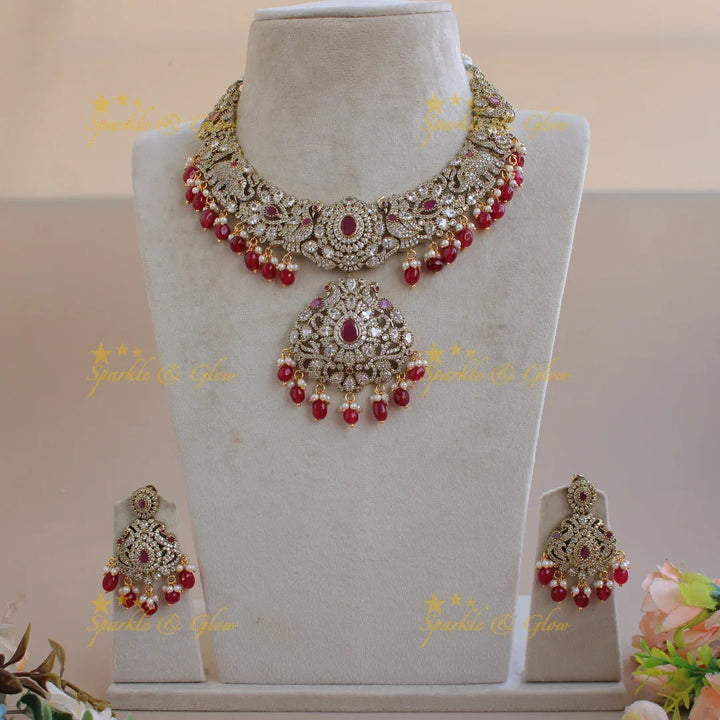 Beautiful Floral Peacock Elephant design Victorian AD short necklace with ruby pearls and red beads - Sparkle and Glow