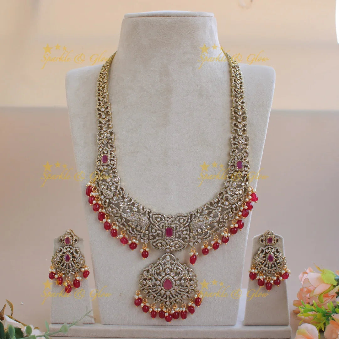 Exclusive grand Floral Elephant Peacock design Victorian AD long necklace with ruby pearls and red beads - Sparkle and Glow