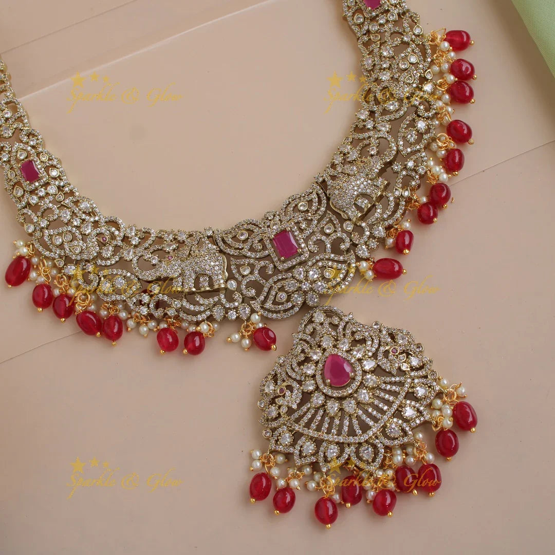 Exclusive grand Floral Elephant Peacock design Victorian AD long necklace with ruby pearls and red beads - Sparkle and Glow