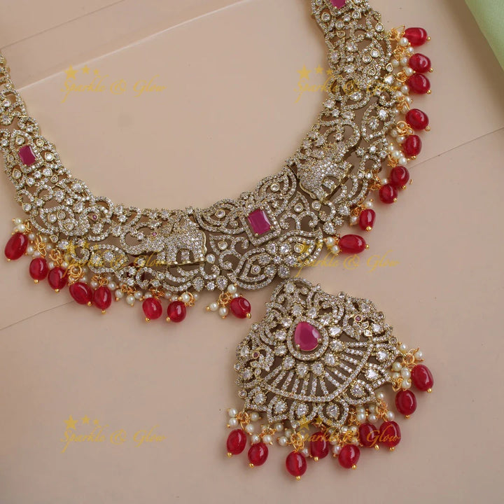 Exclusive grand Floral Elephant Peacock design Victorian AD long necklace with ruby pearls and red beads - Sparkle and Glow
