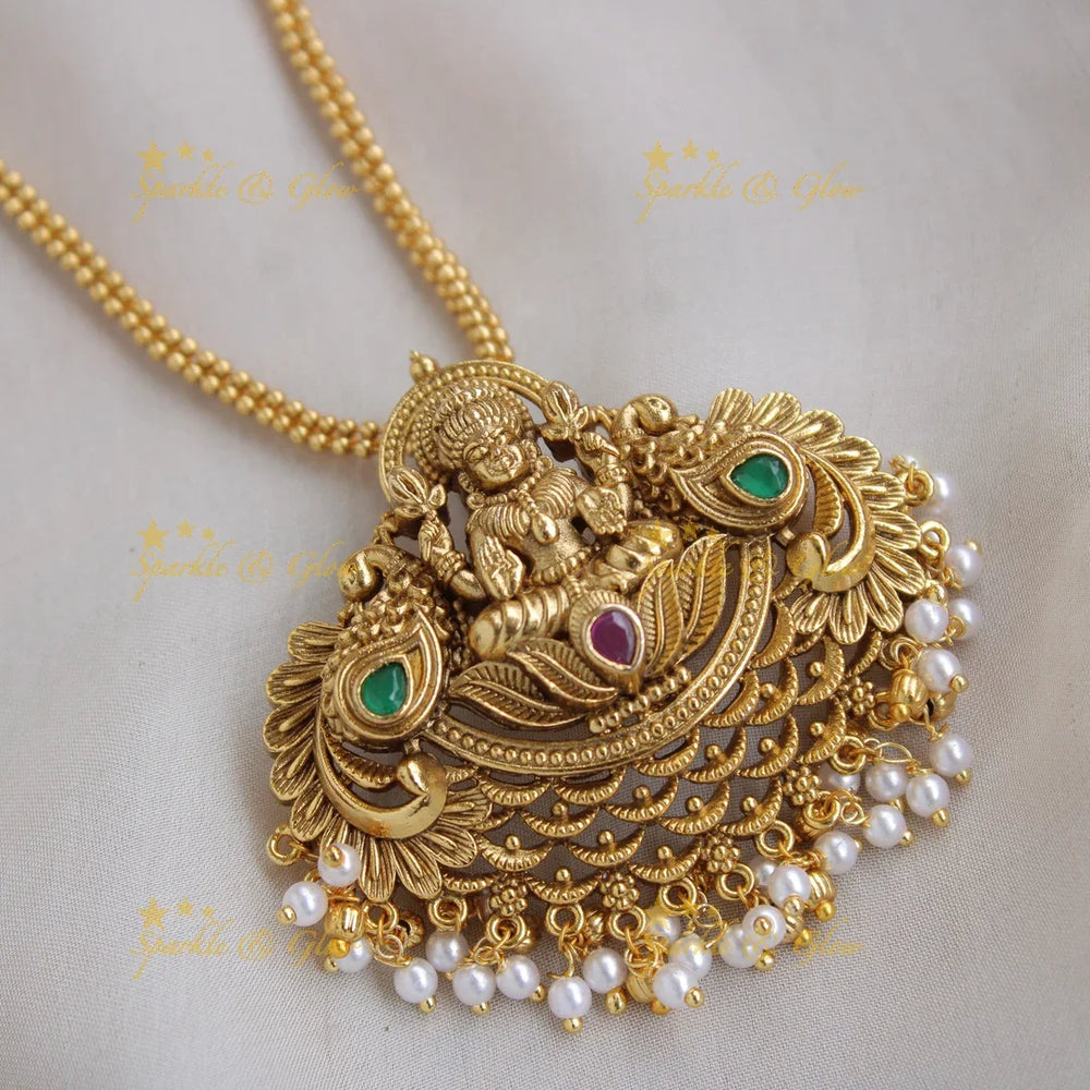 Gold Alike Lakshmi peacock carved pendent with chain with pearls - Sparkle and Glow