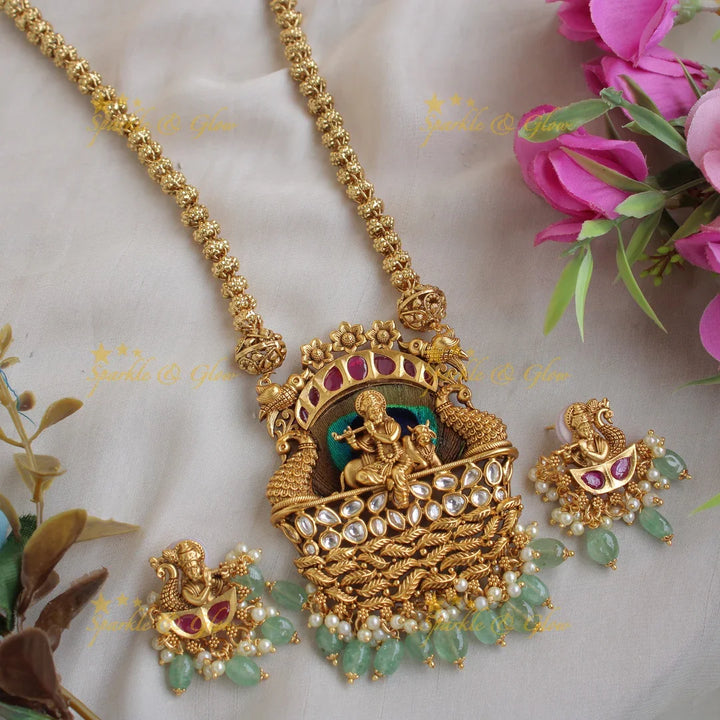 Gorgeous Krishna playing flute and peacock carved pendent with chain with stones and mint green beads - Sparkle and Glow