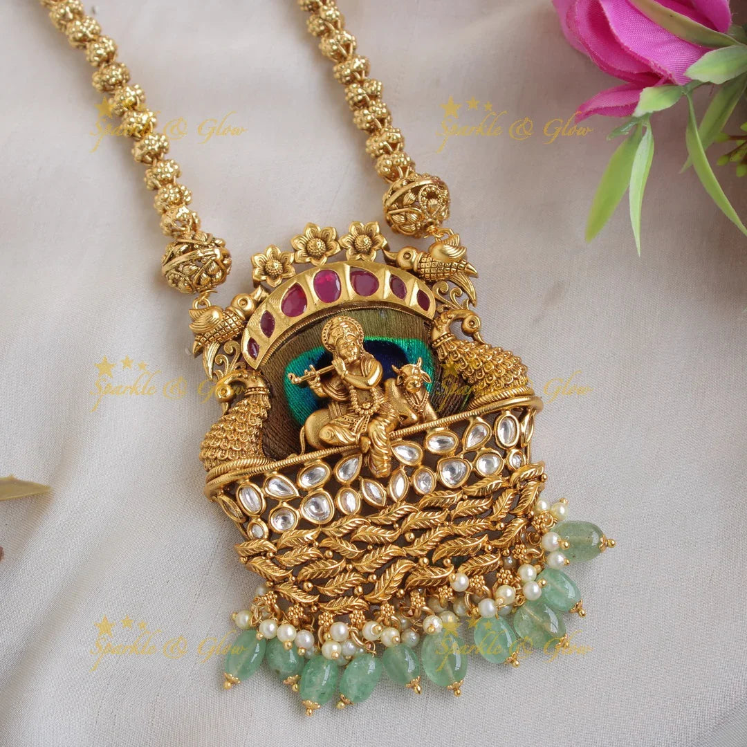 Gorgeous Krishna playing flute and peacock carved pendent with chain with stones and mint green beads - Sparkle and Glow