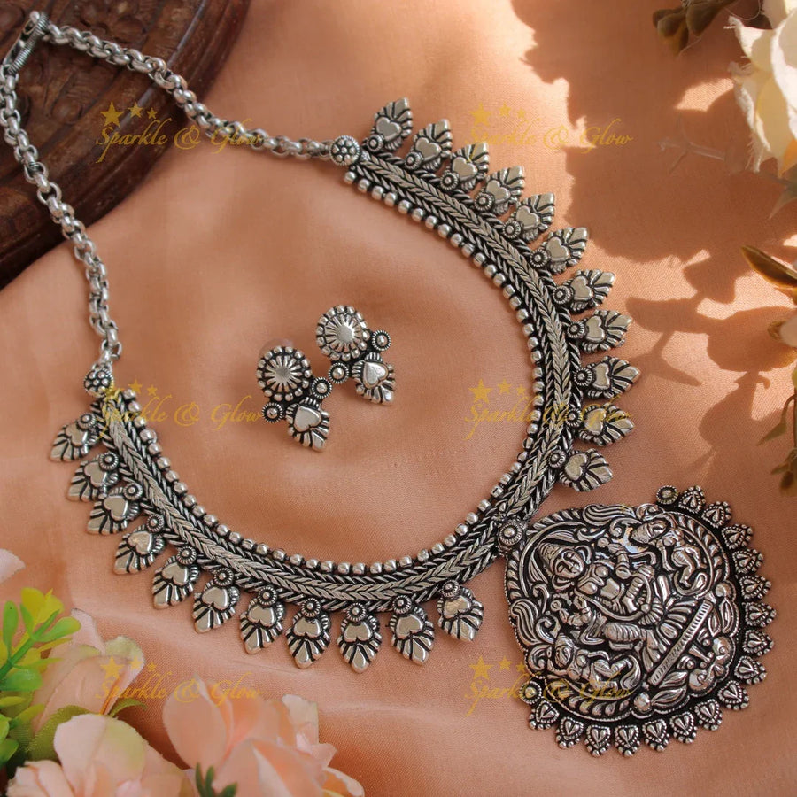 Statement Kohlapuri oxidised Lakshmi carved pendant floral silver short necklace with silver beads - Sparkle and Glow