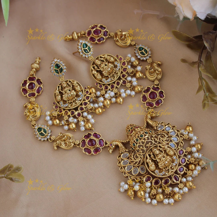 Elegant Lakshmi peacock carved floral short necklace with ruby emerald and pearls and gold beads - Sparkle and Glow