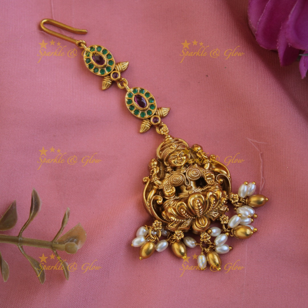Beautiful Lakshmi carved gold alike maang tikka with ruby emerald rice pearls and gold beads