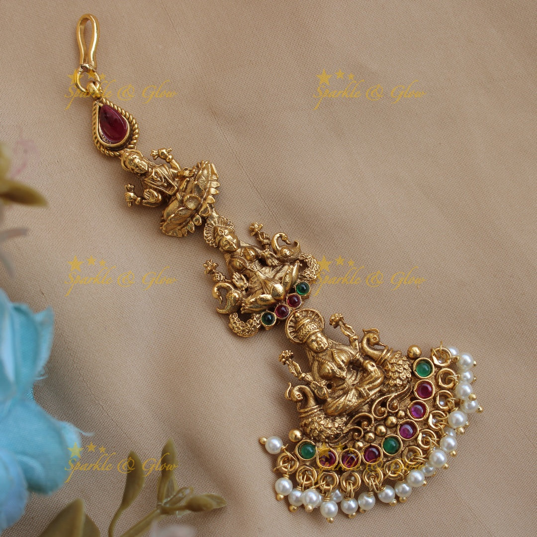 Statement Lakshmi peacock carved maang tikka with ruby emerald and pearls