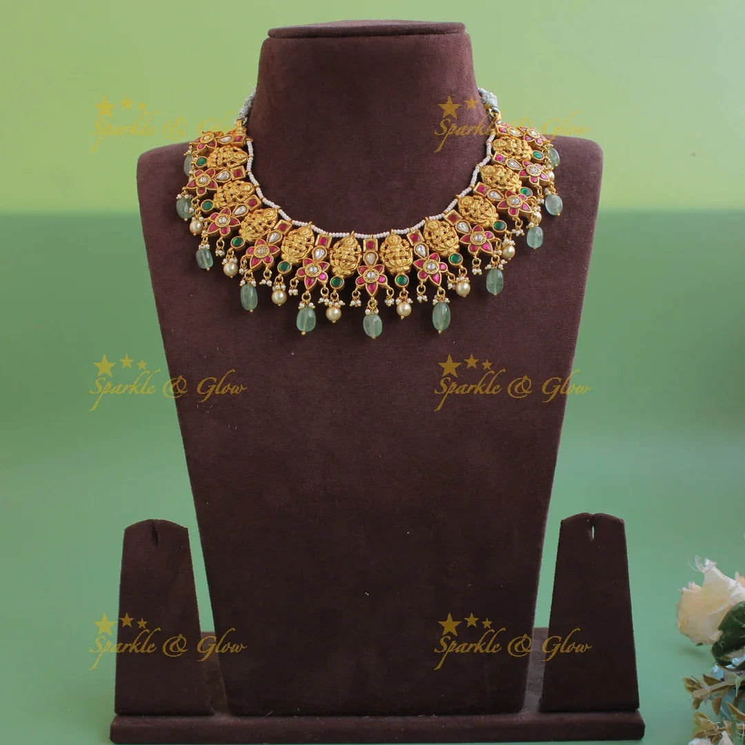 Beautiful Lakshmi carved jadau short necklace with pearls and mint green beads - Sparkle and Glow