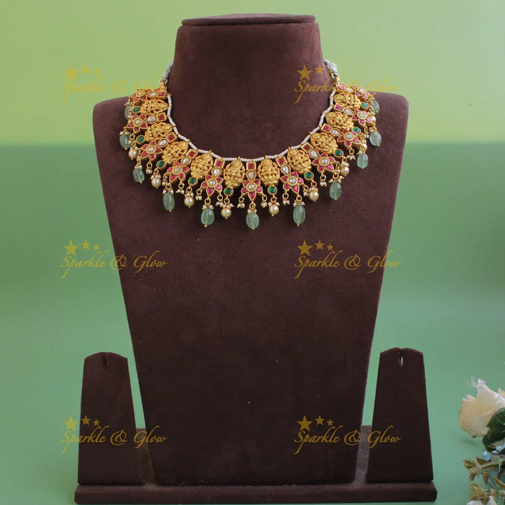 Beautiful Lakshmi carved jadau short necklace with pearls and mint green beads - Sparkle and Glow