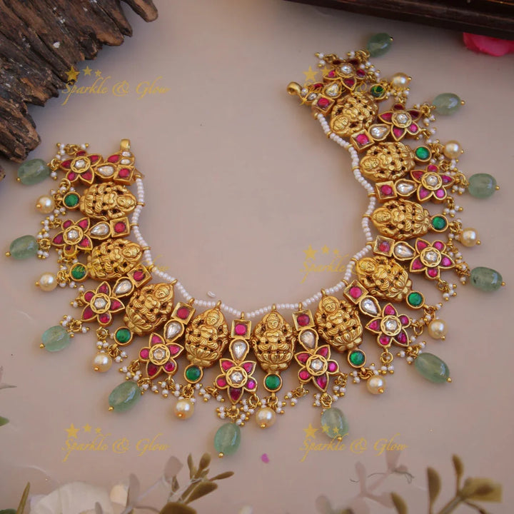 Beautiful Lakshmi carved jadau short necklace with pearls and mint green beads - Sparkle and Glow