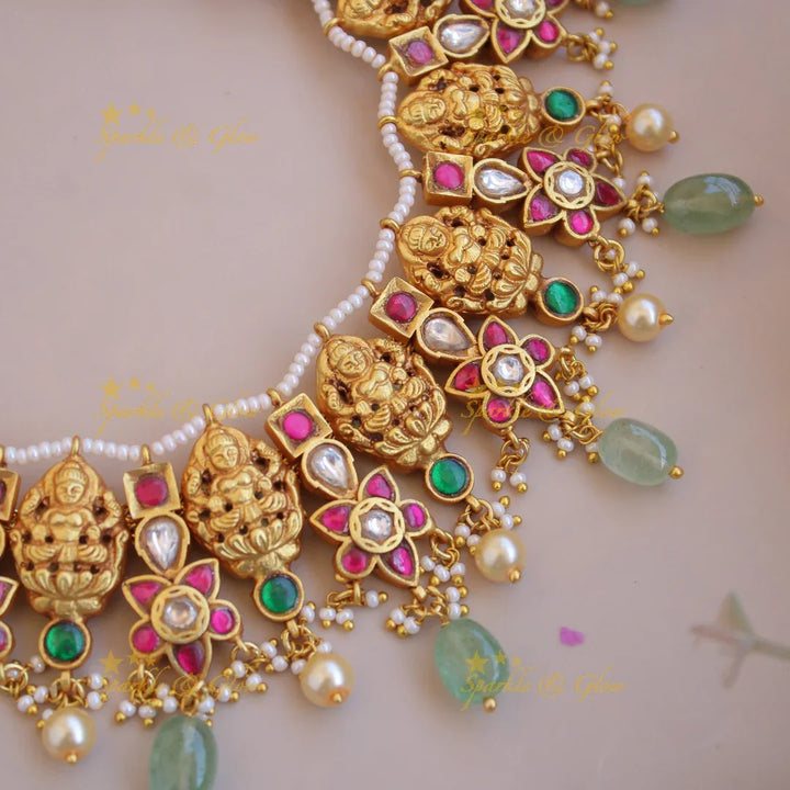 Beautiful Lakshmi carved jadau short necklace with pearls and mint green beads - Sparkle and Glow