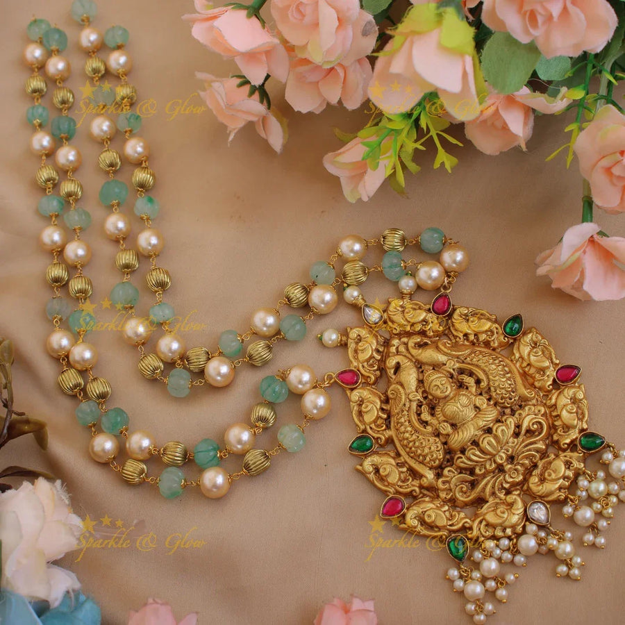 Statement Lakshmi peacock carved jadau pendent with two layer pearl gold and green beads chain - Sparkle and Glow