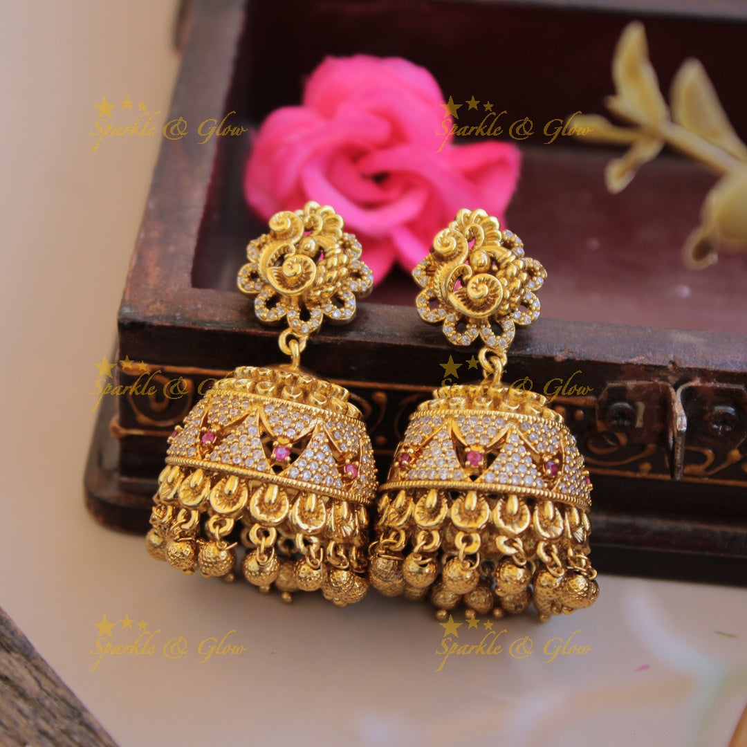 Gold alike peacock carved CZ stone jhumukas with ruby and gold beads