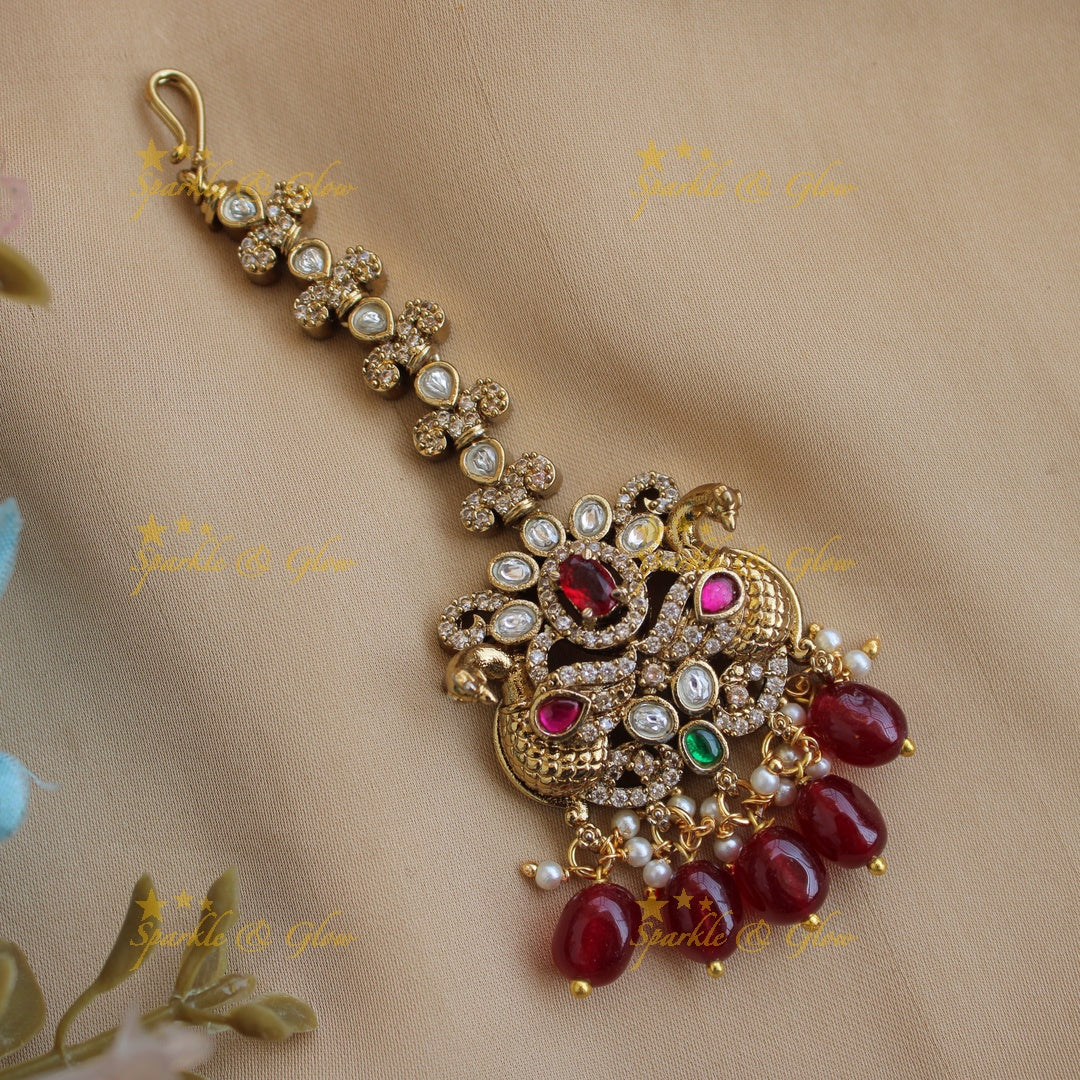 Peacock and floral design victorian maang tikka with red stones and red beads