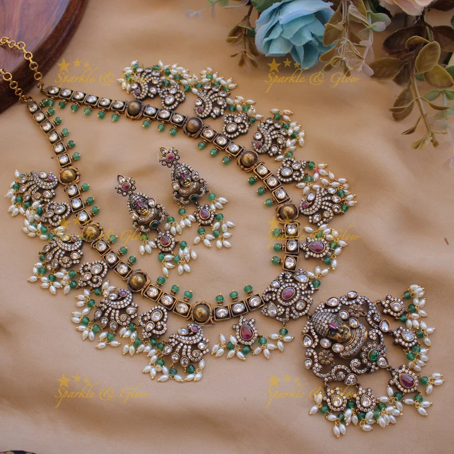 Exclusive Balaji carved Victorian AD gutta pusalu haram with floral peacock drops rice pearls and mint green beads - Sparkle and Glow