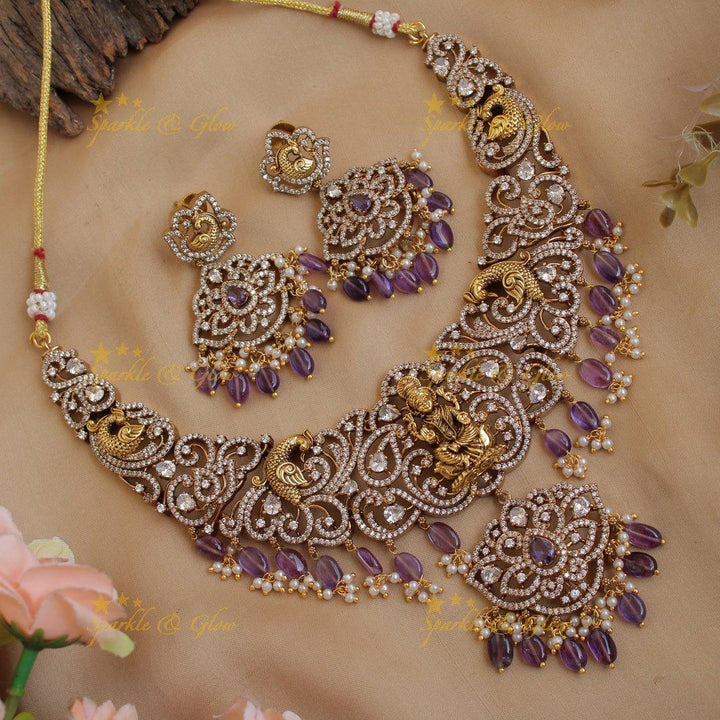 Exclusive Lakshmi peacock carved floral dual tone victorian AD short necklace with purple beads - Sparkle and Glow