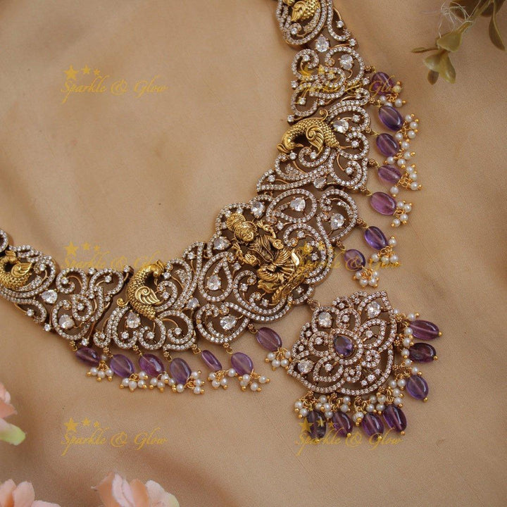 Exclusive Lakshmi peacock carved floral dual tone victorian AD short necklace with purple beads - Sparkle and Glow