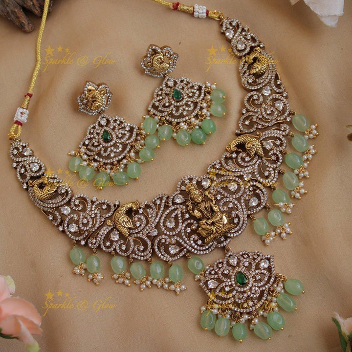 Exclusive Lakshmi peacock carved floral dual tone victorian AD short necklace with purple beads - Sparkle and Glow