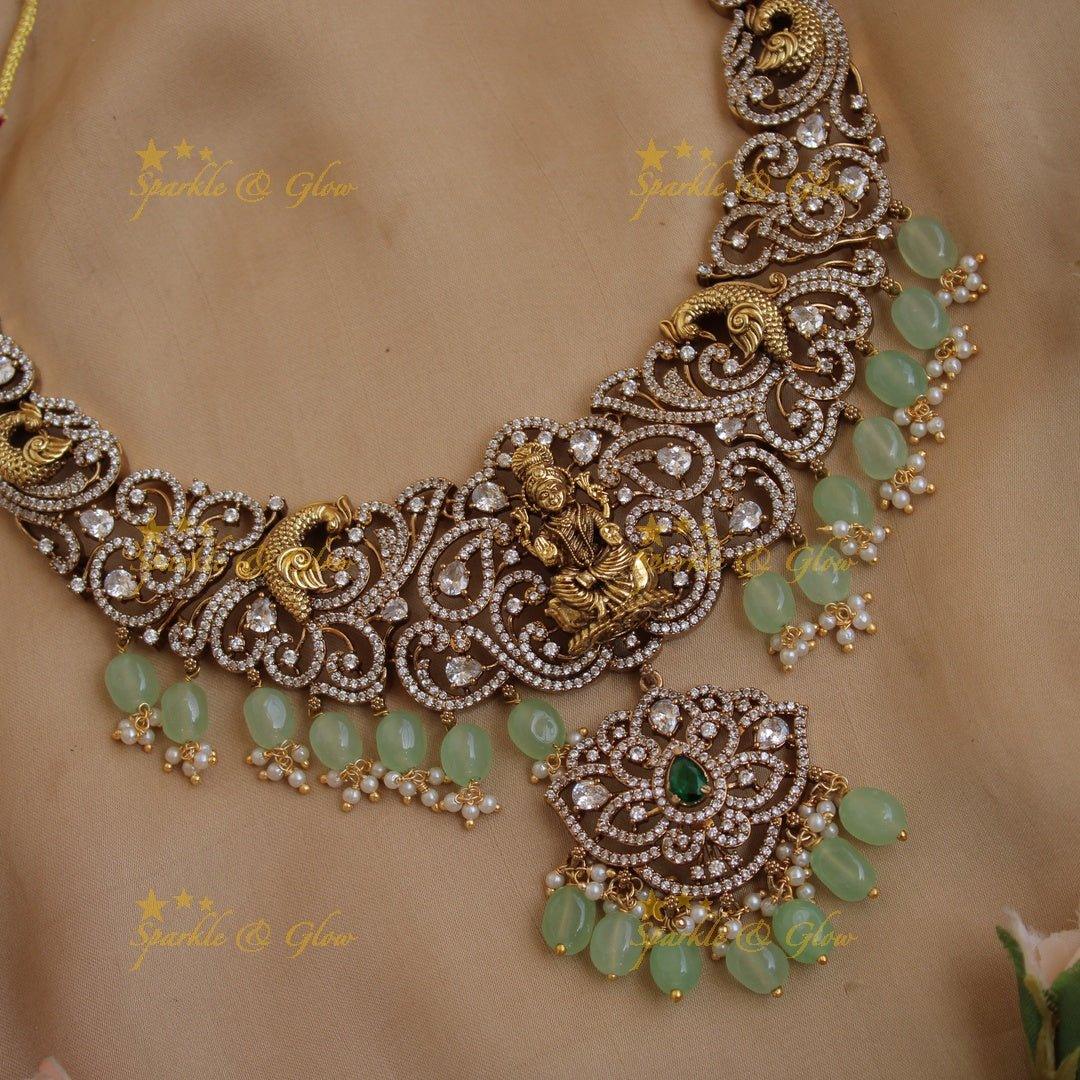 Exclusive Lakshmi peacock carved floral dual tone victorian AD short necklace with purple beads - Sparkle and Glow