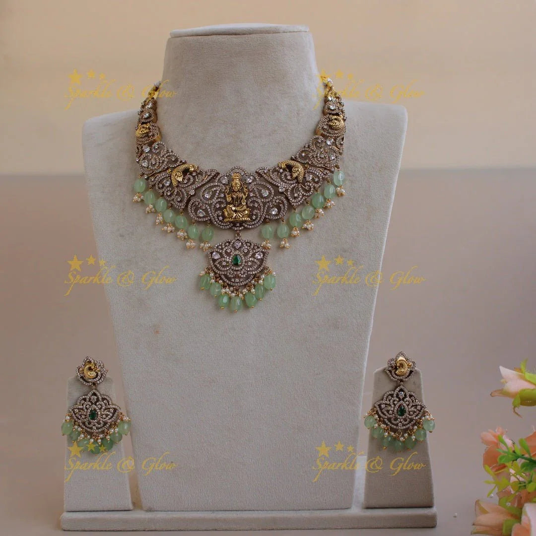 Exclusive Lakshmi peacock carved floral dual tone victorian AD short necklace with purple beads - Sparkle and Glow