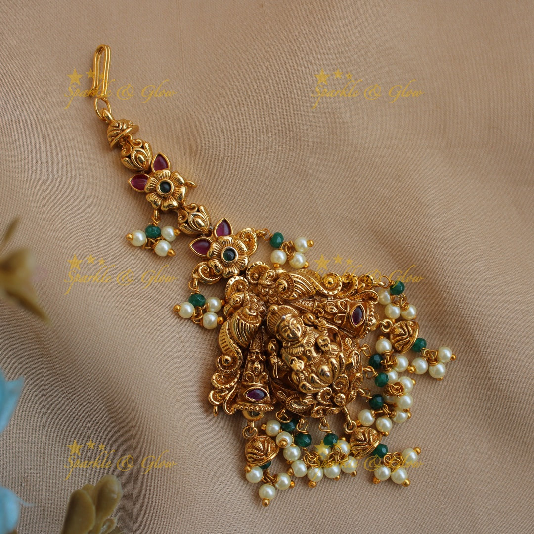 Elegant gold alike lakshmi and peacock maang tikka with pearl beads